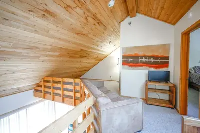 a room with a wooden ceiling at Windham Mountain Village Condo in Windham