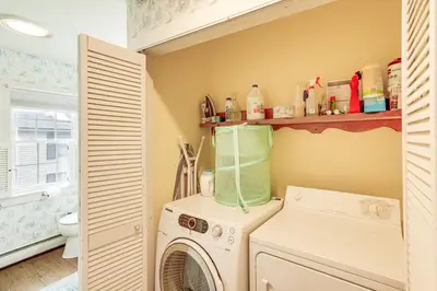 a laundry room with a washer and dryer at Lake Views and Dock Access - Pittsfield Cottage! in Pittsfield