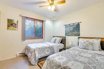 a bedroom with two beds and a ceiling fan at Near Water Parks Pet-Friendly Tobyhanna Getaway! in Tobyhanna
