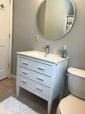a bathroom with a white sink and a mirror at Luxury Woodstock Family Retreat with pool hot tub in Woodstock