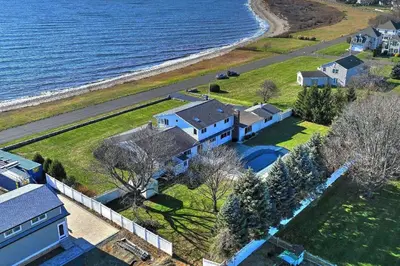 an aerial view of a house next to the ocean at Akasa in Stratford