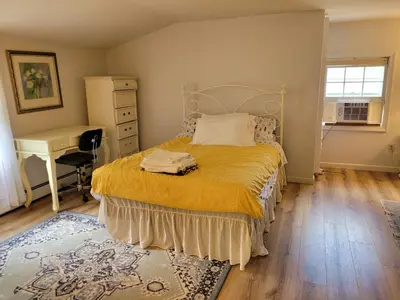a bedroom with a bed and a desk and a chair at East Granby with AC and WiFi 3 minute to Bradley in East Granby