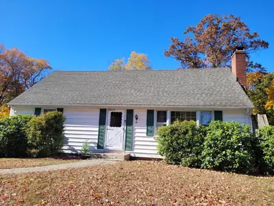 a white house with a gray roof at East Granby with AC and WiFi 3 minute to Bradley in East Granby