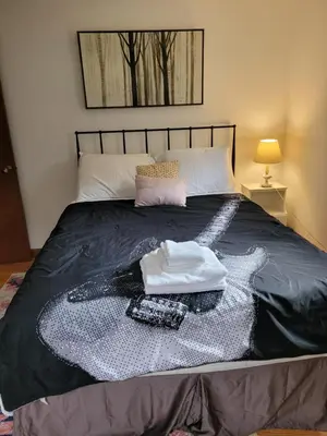 a bed with a blanket and a towel on it at East Granby with AC and WiFi 3 minute to Bradley in East Granby