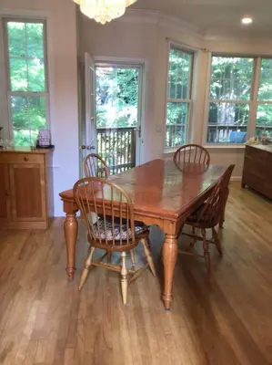 a dining room with a wooden table and chairs at Enjoy all Westport has to offer! in Westport