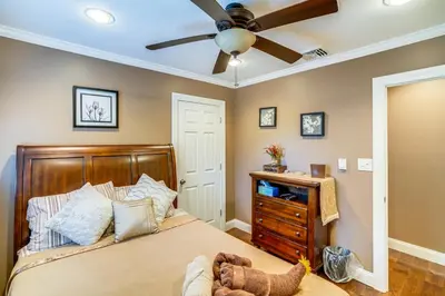 a bedroom with a bed and a ceiling fan at Private Hot Tub on 10 Acres Cozy Catskill Getaway in Catskill