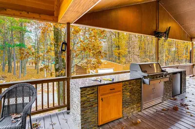 a screened in porch with a grill on a deck at Private Hot Tub on 10 Acres Cozy Catskill Getaway in Catskill