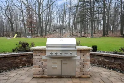 a stone oven in a yard with a park at Nature Getaway Charming Villa Near Trails & Parks in Monroe