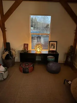 a room with a window and a table with a lamp at BataviaKill Homestead in Prattsville