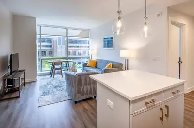 a living room with a couch and a table at Modern Apt Close to Downtown in Stamford