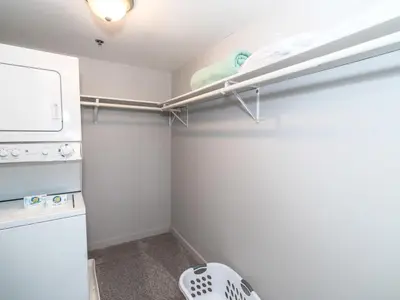 a small kitchen with a refrigerator and a stove at Private Apt Close to Train in Stamford
