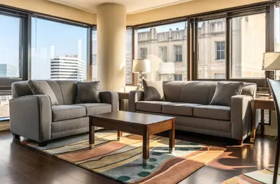 a living room with two couches and a coffee table at Private Apt Downtown in Stamford