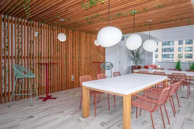 a dining room with a white table and chairs at Entire Apt Downtown with Gym in Stamford
