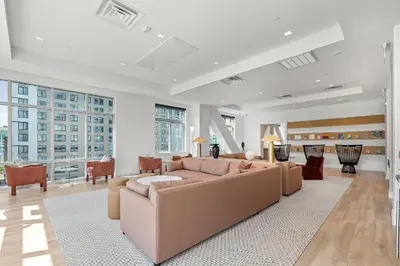 a large living room with a large couch and chairs at Entire Apt Downtown with Gym in Stamford