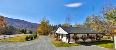 a small house on the side of a road at Mountain Dream Brand New Hot Tub Fire Pit in Hunter