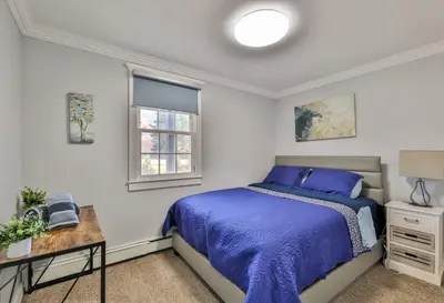 a bedroom with a bed and a desk and a window at Mountain Dream Brand New Hot Tub Fire Pit in Hunter