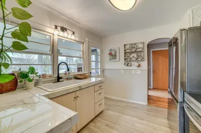 a kitchen with a sink and a refrigerator at 1 Mi to Historic District Mtn-View Franklin Home in Otego