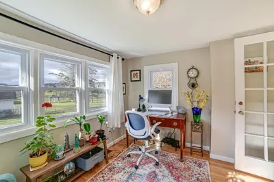 an office with a desk and a computer in a room with windows at 1 Mi to Historic District Mtn-View Franklin Home in Otego
