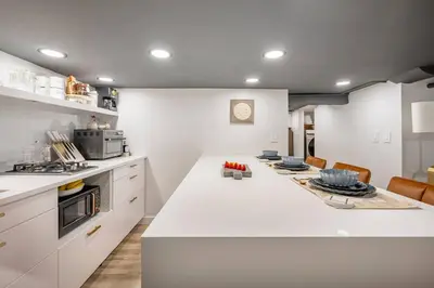 a kitchen with a large white island in a kitchen at Romantic Hideout 1Bedroom Lower Level in Stamford