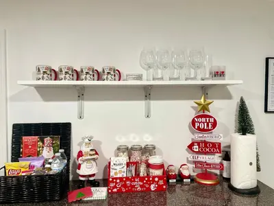 a counter with christmas items on a shelf at Pelham Haven Suite in New York in Pelham