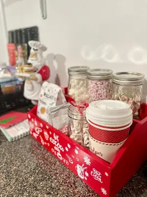 a red tray with jars of food and a cup of coffee at Pelham Haven Suite in New York in Pelham