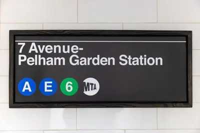 a sign for a german garden station on a wall at Pelham Haven Suite in New York in Pelham