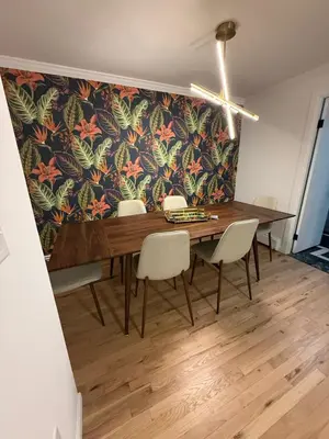 a dining room table with chairs and a floral wallpaper at Luxury Boutique Home - 5 Beds 2 Baths 25 minutes to NYC in Jersey City