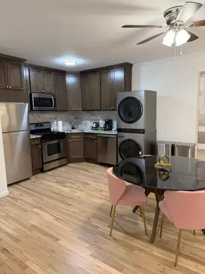 a kitchen with a table and chairs in a room at Luxury Boutique Home - 4 Beds 1 Baths 25 minutes to NYC in Jersey City