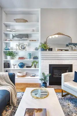 a living room with a couch and a fireplace at Hudson Navigator in Hudson