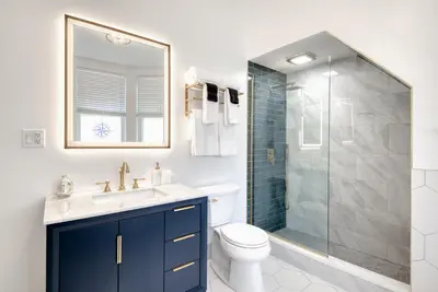 a bathroom with a toilet and a glass shower at Hudson Navigator in Hudson