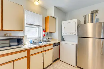 a kitchen with a refrigerator and a sink at Beachfront, Dog-Friendly Milford Getaway with Yard! in Milford