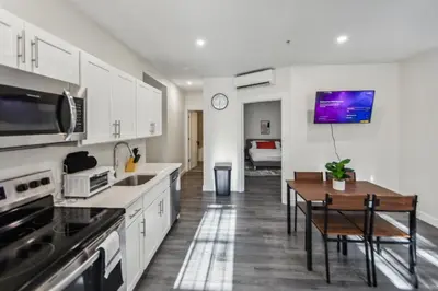 a kitchen with a table and a dining room at Washington Lofts 109 Spacious 1 Bedroom 1 Bath in Albany