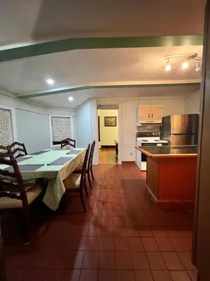 a kitchen and dining room with a table and chairs at Holyoke House Oasis - Fast Wifi, Spacious, Quiet Neighborhood in Holyoke
