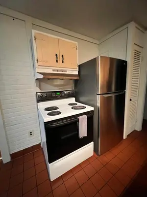 a kitchen with a stove and a refrigerator at Holyoke House Oasis - Fast Wifi, Spacious, Quiet Neighborhood in Holyoke