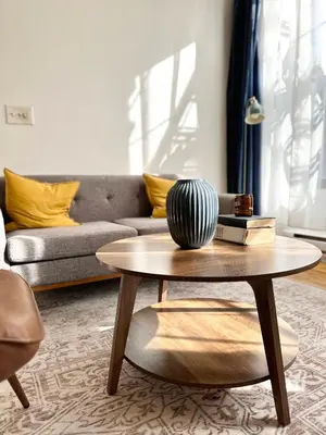 a living room with a coffee table and a couch at Cottage 215 Apartments in New York