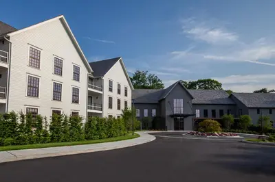 a house with a driveway in a residential neighborhood at Delamar Westport in Westport