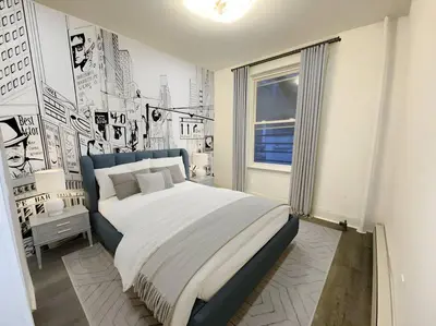 a bedroom with a large bed in a room at Manhattan Skyline Mins to TimeSQ in West New York