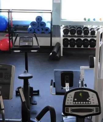 a room with a gym with a computer and weights at MOUNT SNOW GREENSPRING 41d in West Dover