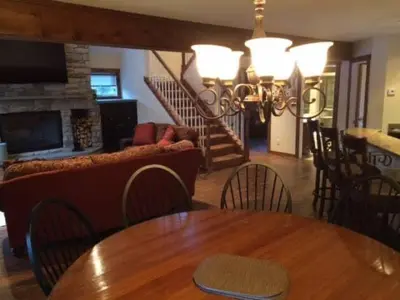 a living room with a table and a couch at MOUNT SNOW GREENSPRING 41d in West Dover