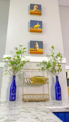 three blue vases sitting on top of a counter at The Rustic Home Albany NY - 3 Bedroom Private Second Floor Apartment in Albany