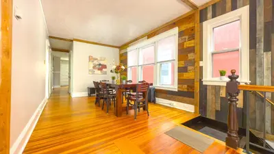 a dining room with a table and chairs at The Rustic Home Albany NY - 3 Bedroom Private Second Floor Apartment in Albany