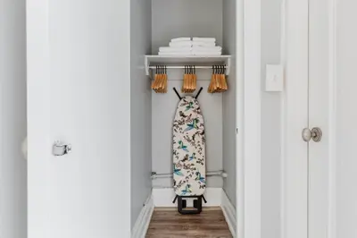 a walk in closet with a dress on a shelf at Blueground Upper West Side ac wd NYC-1546 in New York