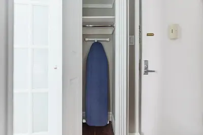a door with a blue pillow in a closet at Blueground Gramercy Park 2bd apartment NYC-1616 in New York