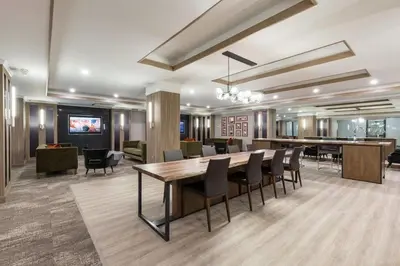 a dining room with a large table and chairs at Blueground Sutton Place 1bd apartment NYC-1630 in New York