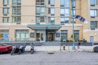 two motorcycles parked in front of a building at Blueground Long Island City 1bd apartment NYC-1612 in New York