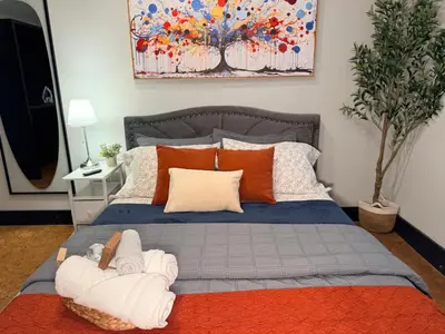 a bedroom with a bed with towels on it at Bright & New Room Shared Apartment NYC Bus in Englewood