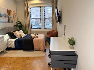a bedroom with a bed and a desk at Bright & New Room Shared Apartment NYC Bus in Englewood