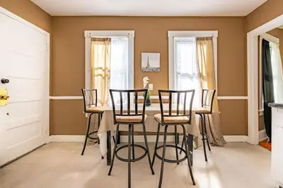 a dining room with a table and chairs at Charming Chicopee Getaway in Chicopee