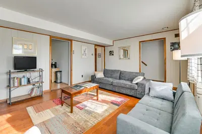 a living room with two couches and a tv at Quiet Catskill Getaway with Fire Pit - Near Hiking! in Catskill