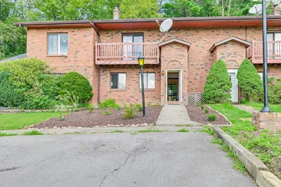a brick house with a driveway in front of it at Quiet Catskill Getaway with Fire Pit - Near Hiking! in Catskill